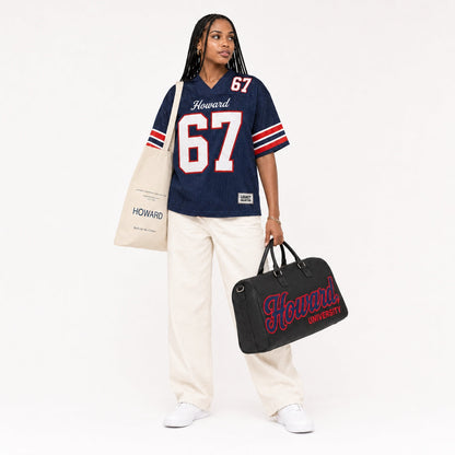 Howard Legacy Campus Collection female campaign model with Howard tote and travel bag