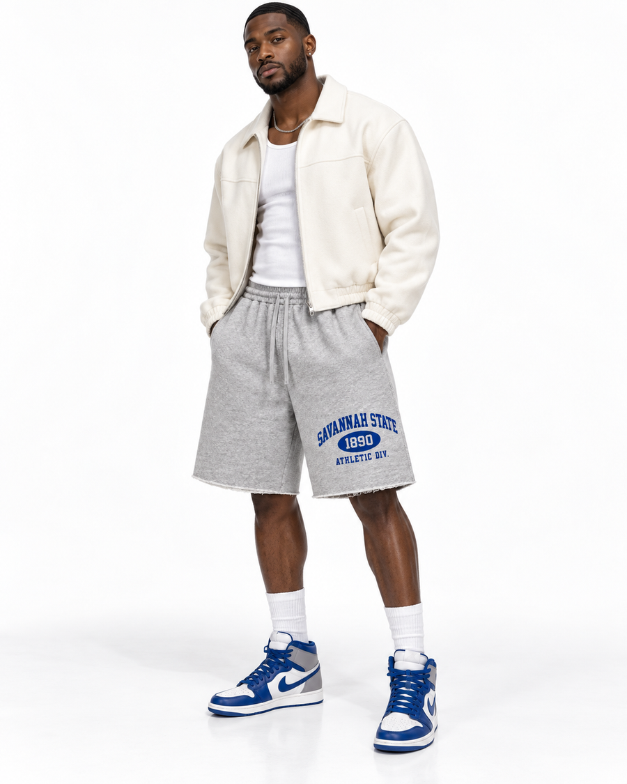 Black male model wearing Savannah State Athletic Division Raw Edge Shorts in a white studio alternate view