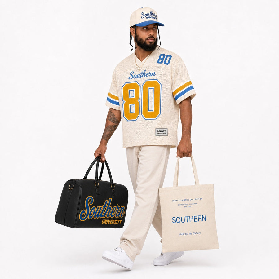 Southern Legacy Campus Collection male campaign model with Southern tote and travel bag alternate view