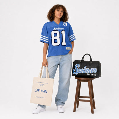 Spelman Legacy Campus Collection female campaign model with Spelman tote and travel bag