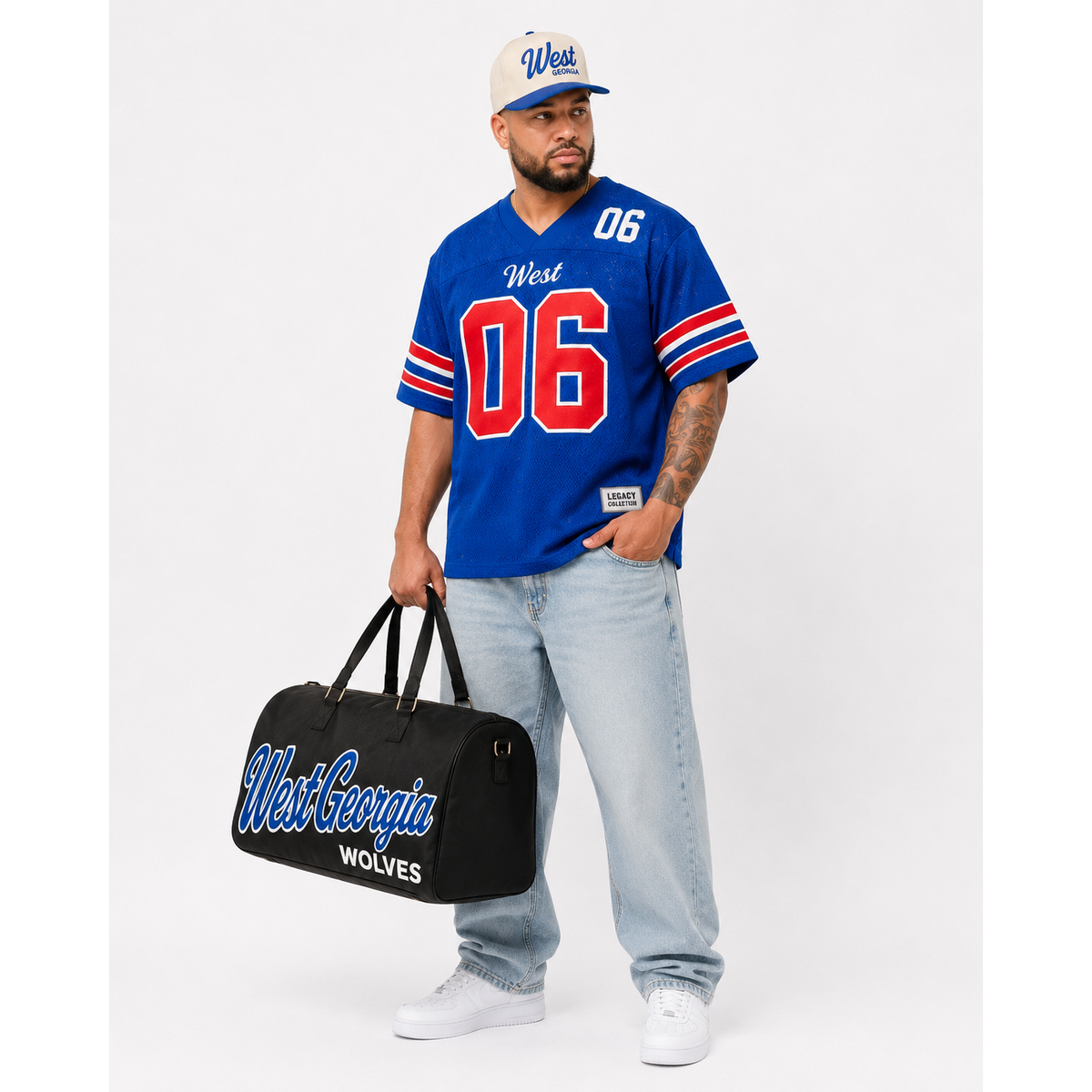 West Georgia Legacy Campus Collection male campaign model wearing West Georgia jersey and cap with travel bag